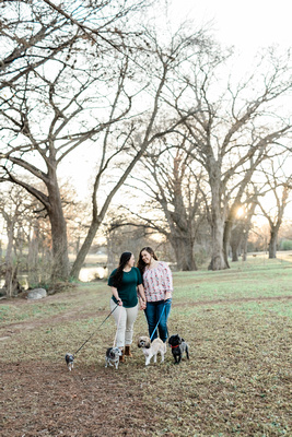 Stephanie and Biance walking their 4 dogs through the park